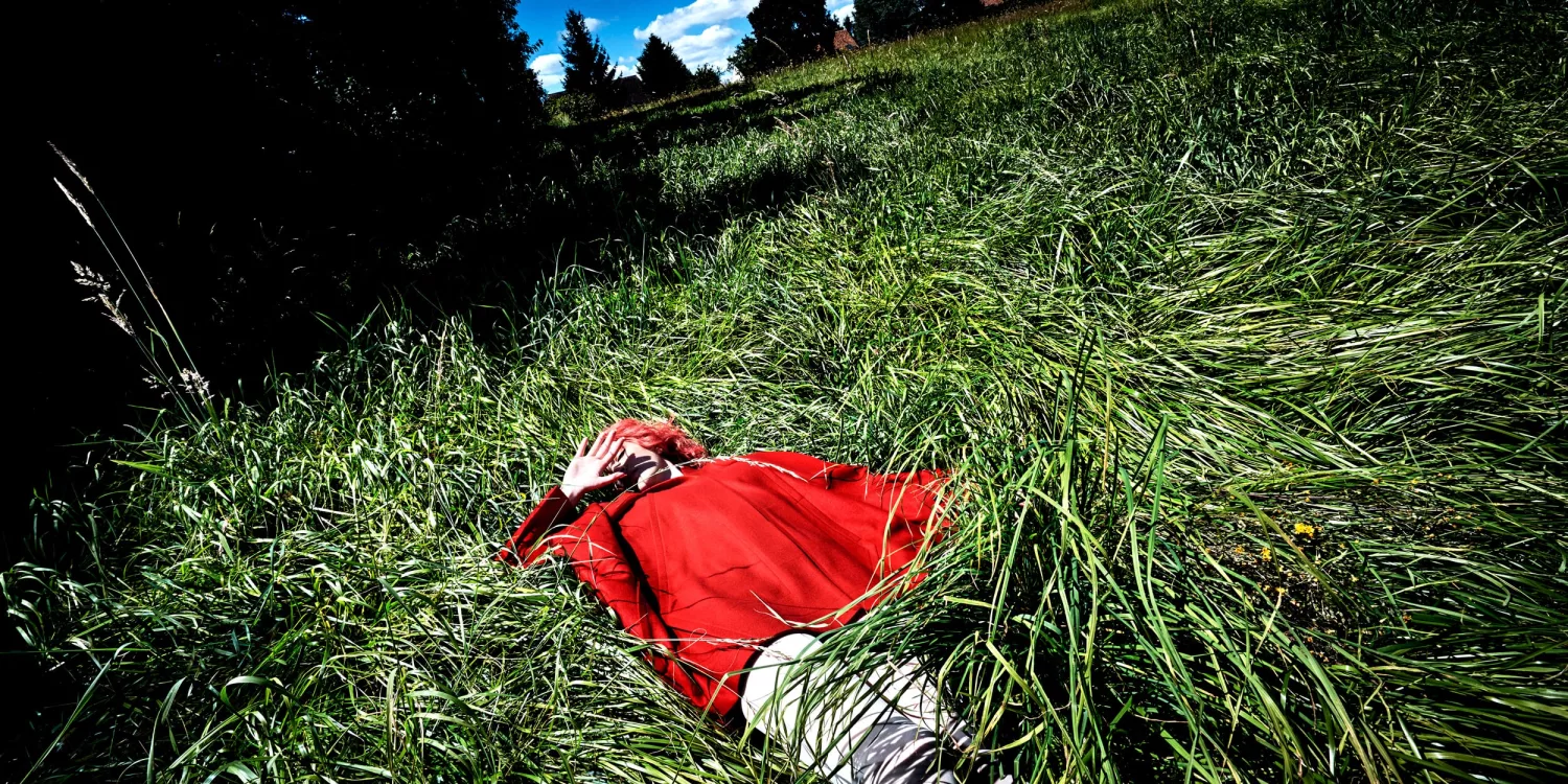 girl with red coat in the grass by Steve Hiett | SPOON Magazine