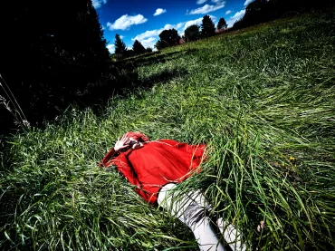 girl with red coat in the grass by Steve Hiett | SPOON Magazine